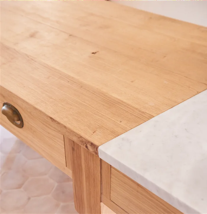 Timber meeting pale stone